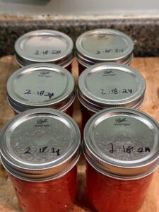 Cans of strawberry jam