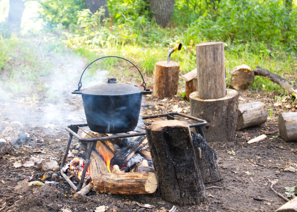 A dutch oven on a fireplace grill is a valuable item for your prepper checklist.