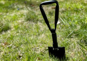 Folding camping shovel. 10 best off-grid bathroom ideas.