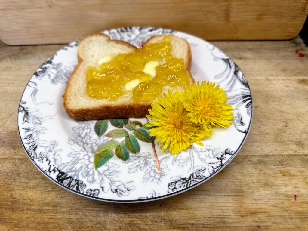 Dandelion jelly on toast with dandelion flower decoration