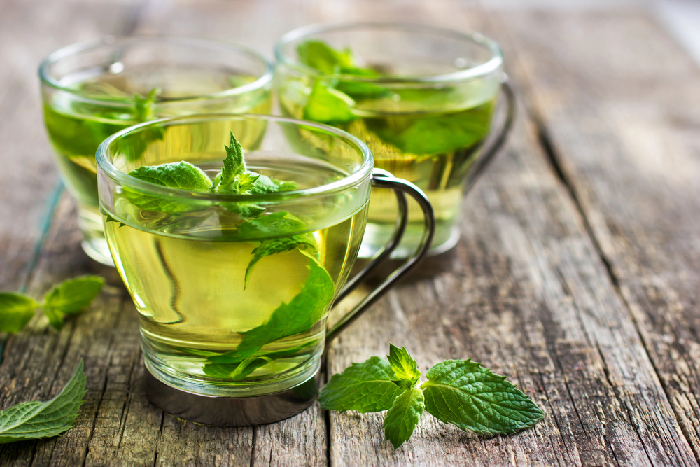 Mint tea in a glass cup.