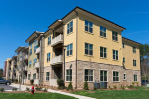 Tan and gray apartment building.